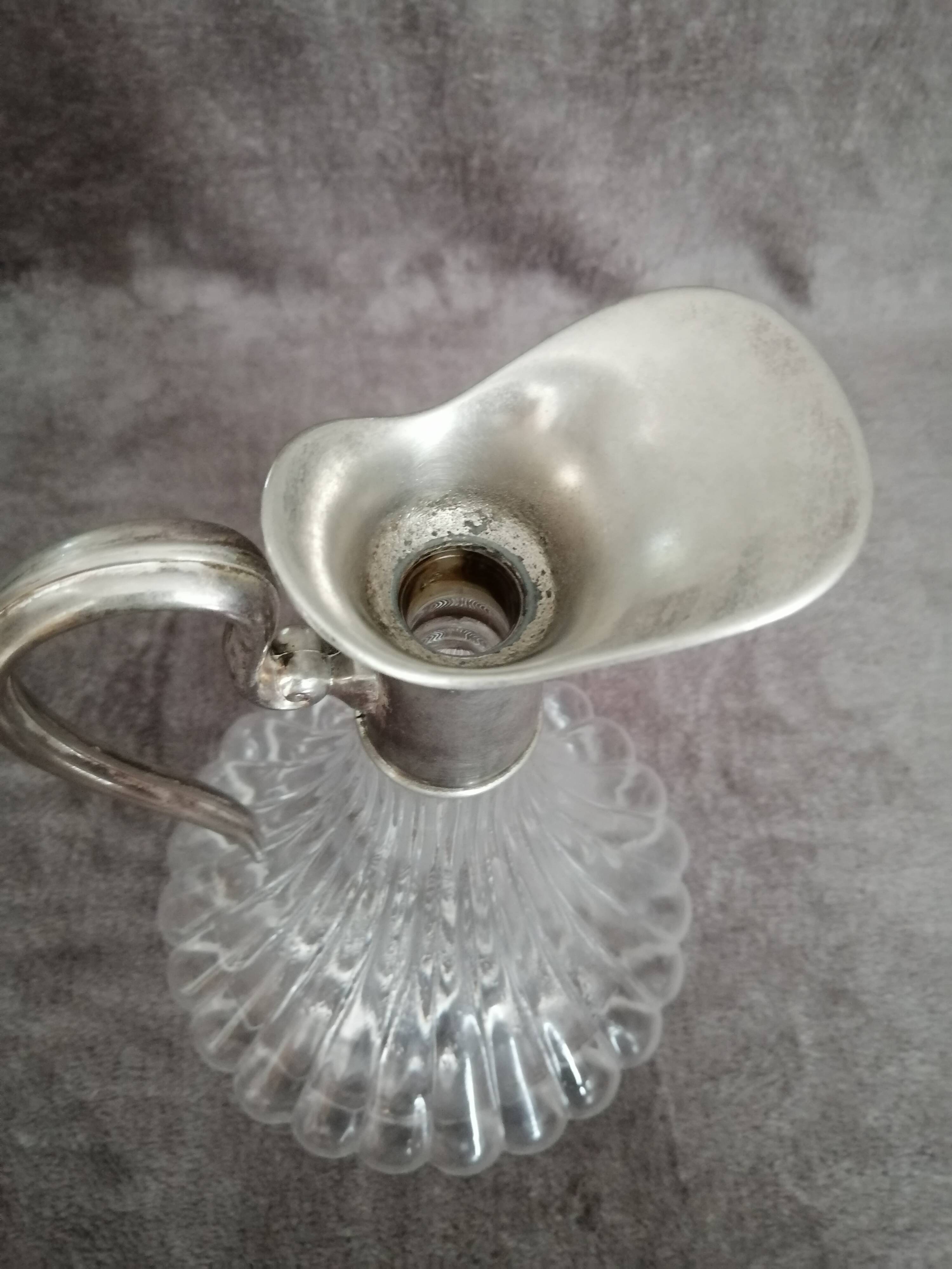 Glass and silver metal wine carafe