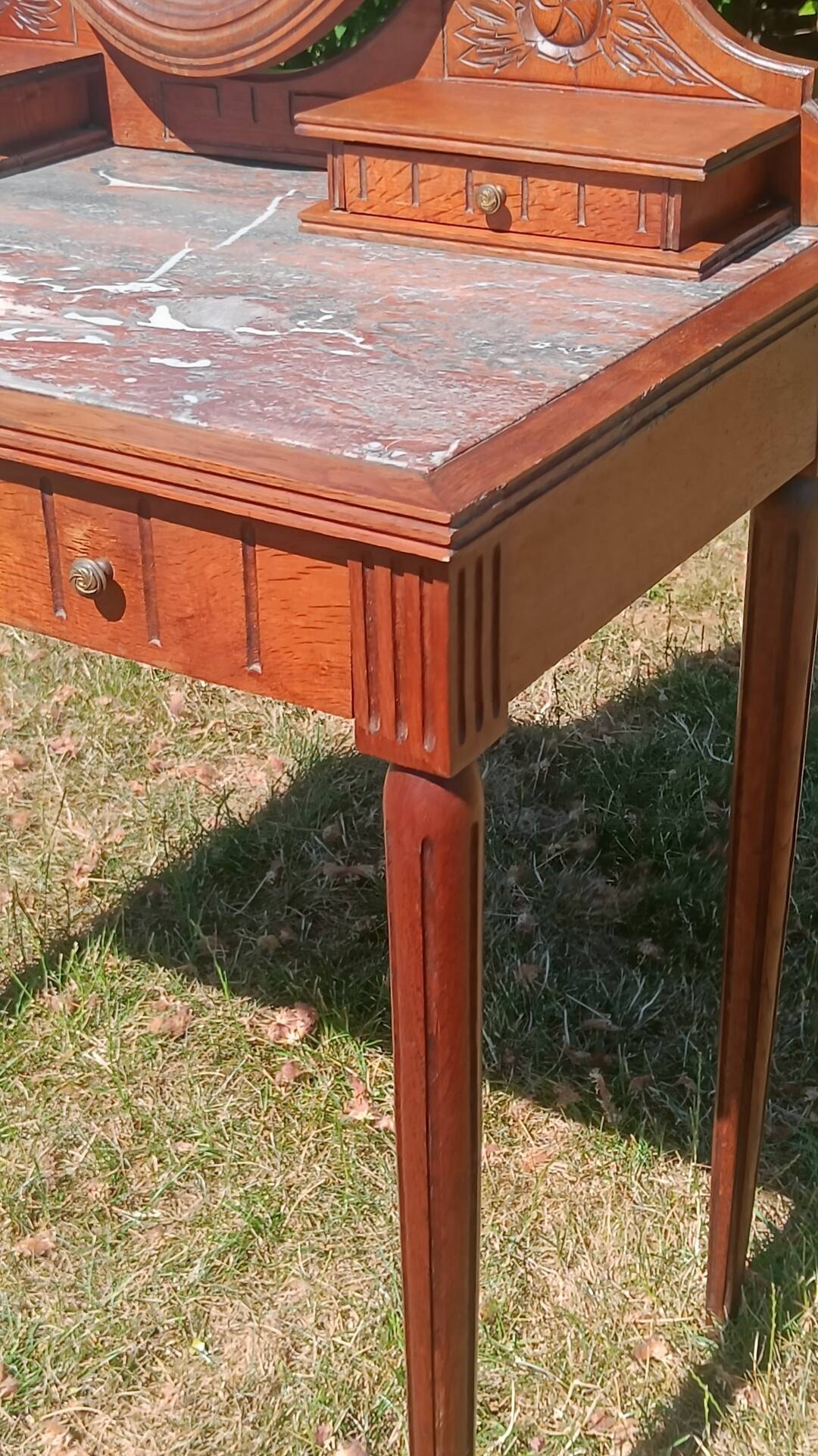 Art Deco oak dressing table, marble top and swivel mirror.
