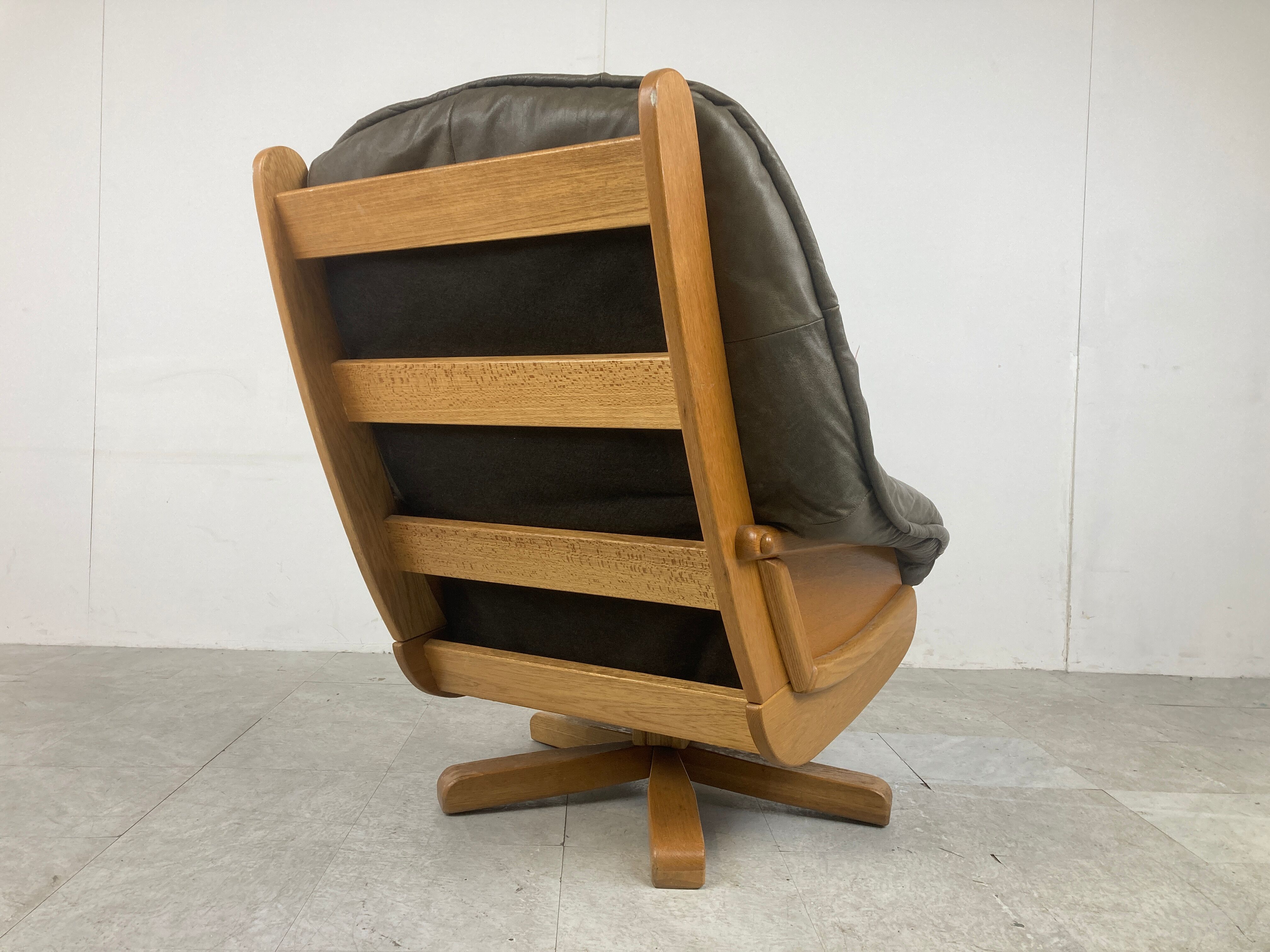 Brutalist oak and leather swivel chair, 1970s