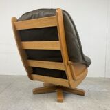 Brutalist oak and leather swivel chair, 1970s
