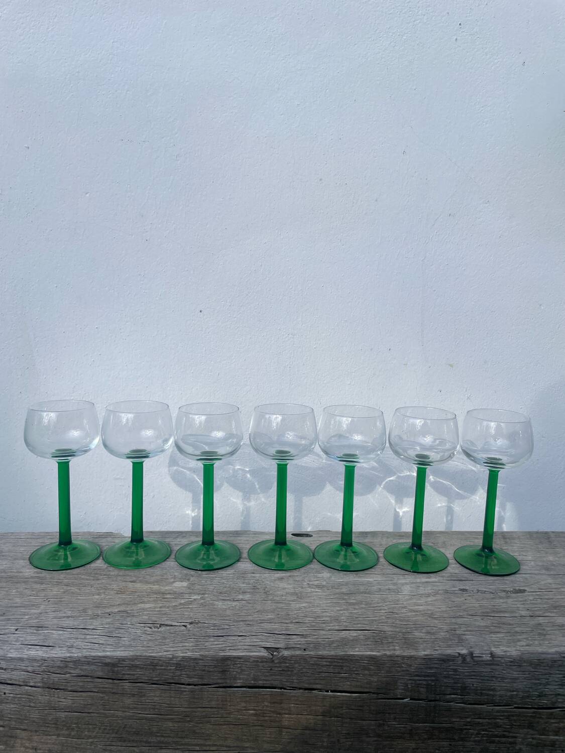 7 green glass stemmed glasses