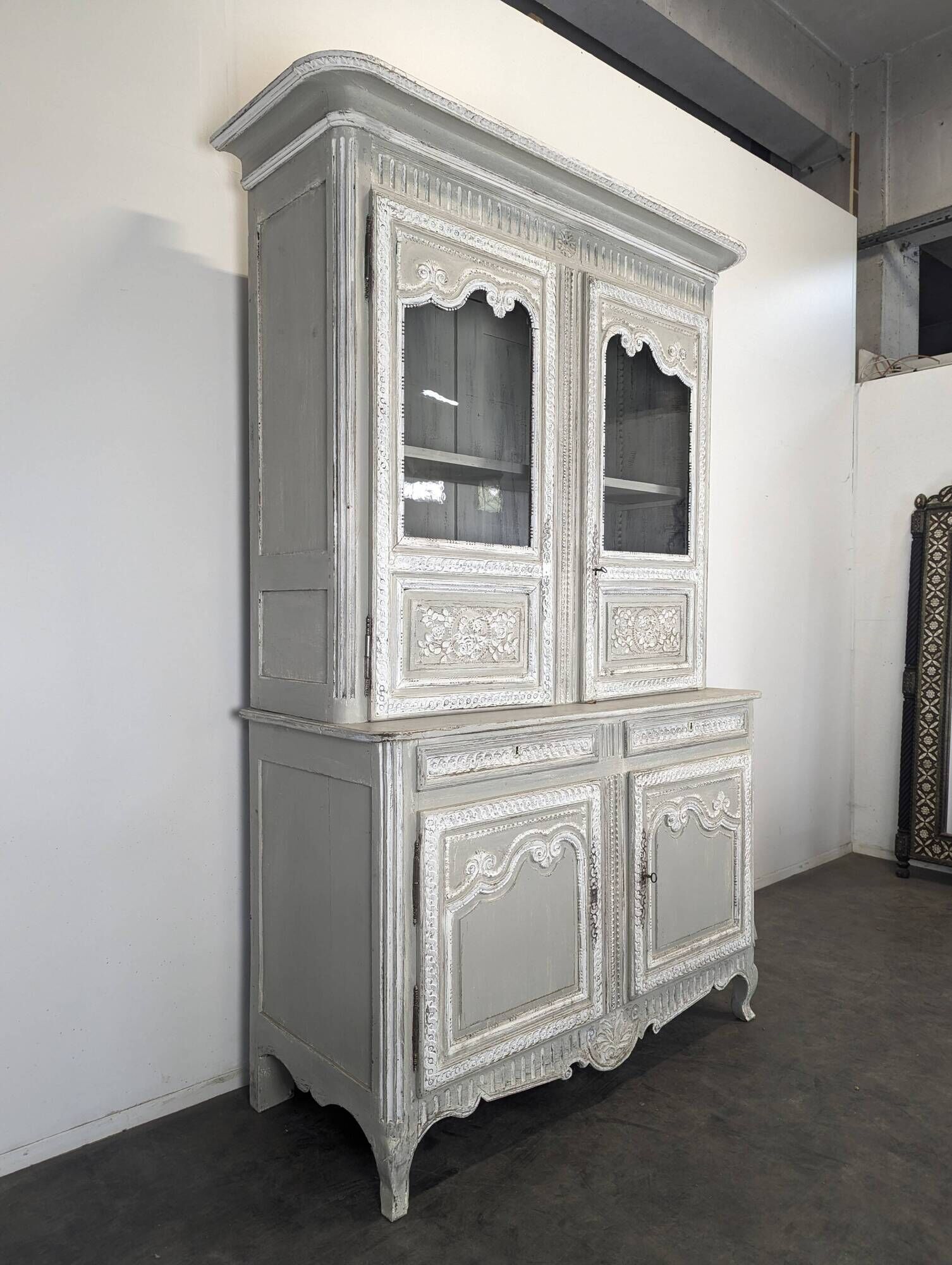 Two-body glass buffet in patinated grey and white oak.