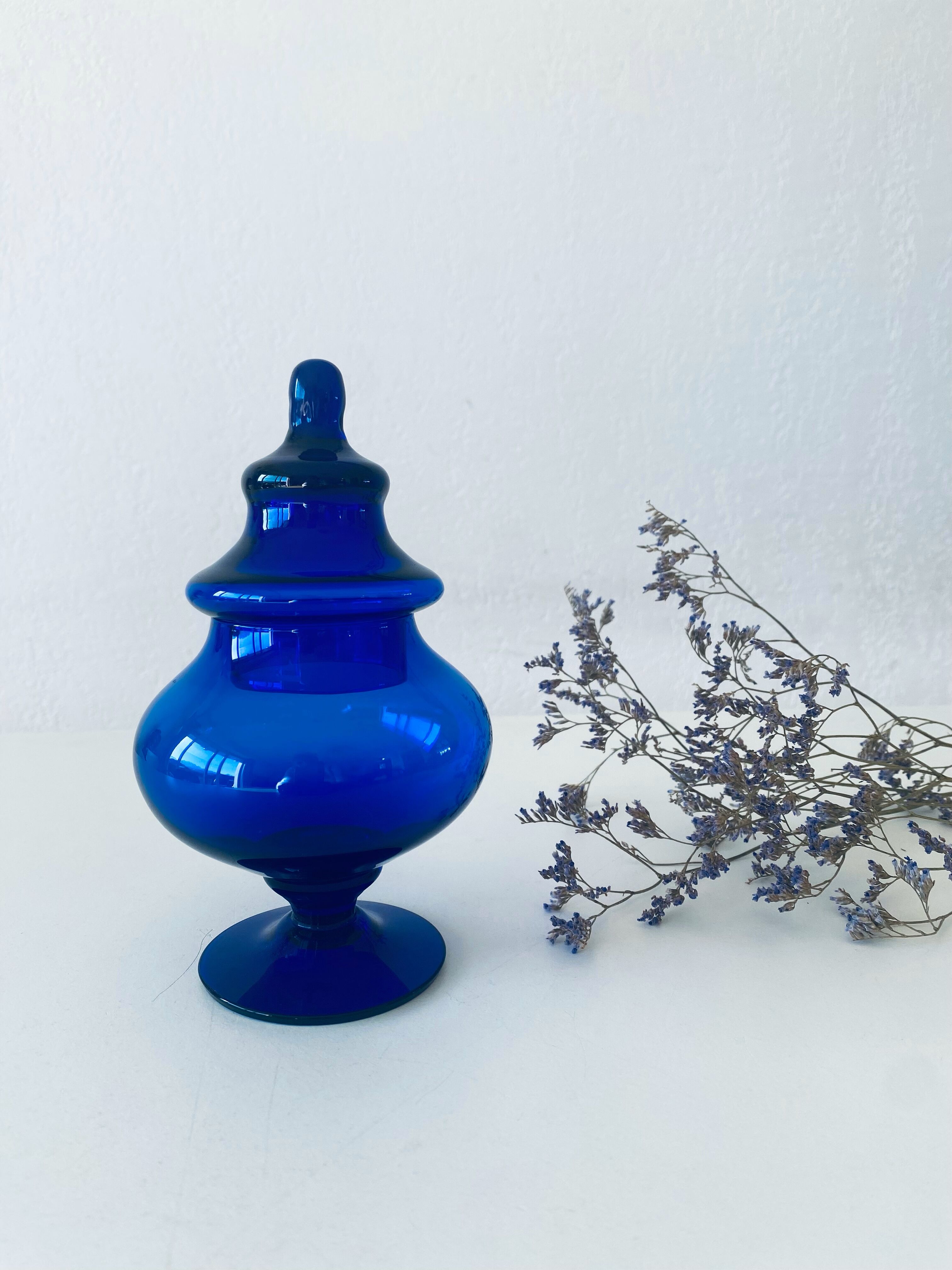 Blue glass apothecary shaped bottle