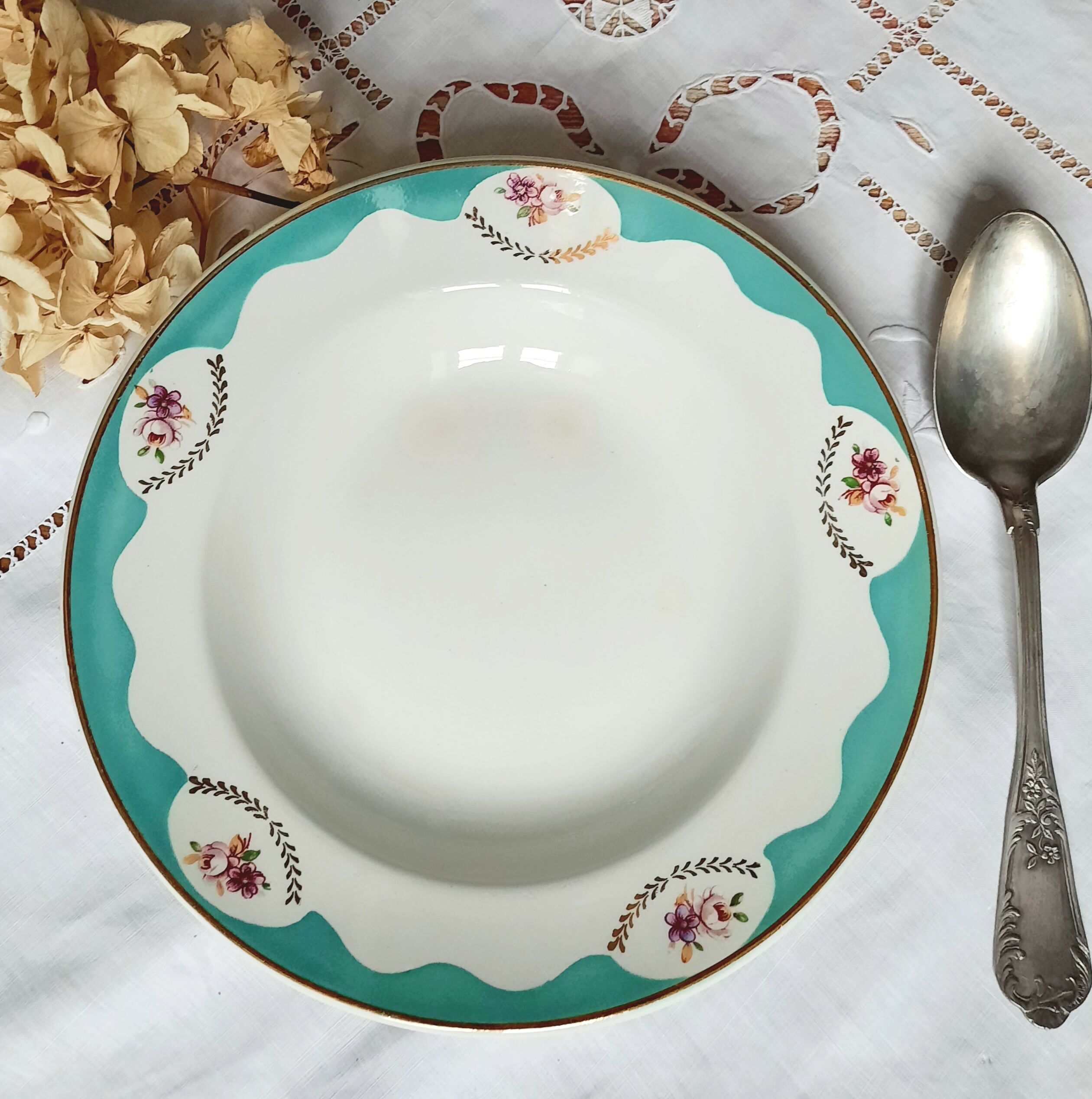 Old hollow plates mismatched in earthenware with gilded edges