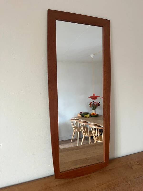 Vintage Danish teak mirror with a rounded back.