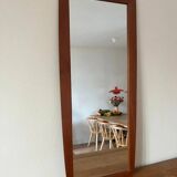 Vintage Danish teak mirror with a rounded back.