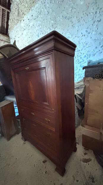Secretary desk with mahogany and flame veneer.