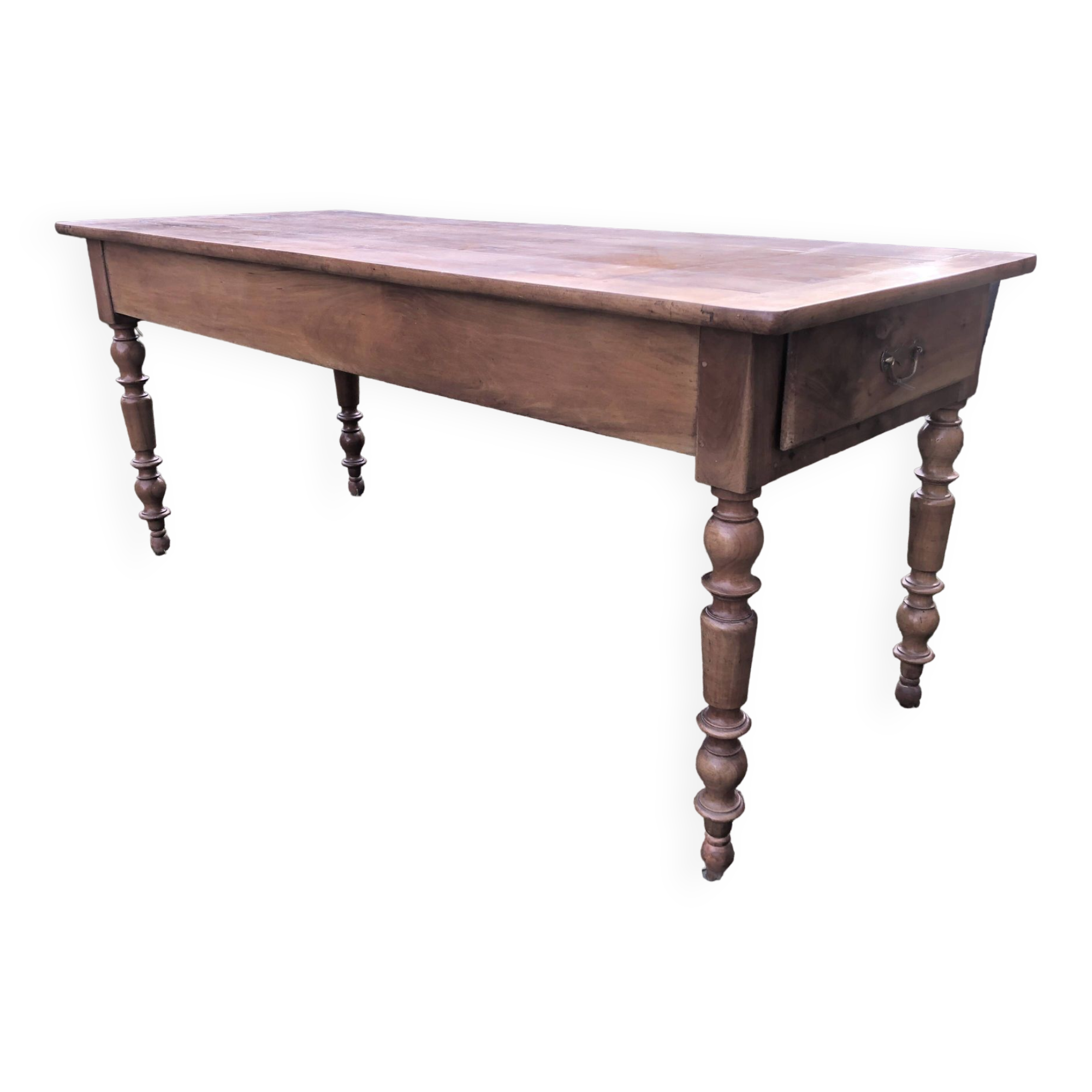 Antique farmhouse table in solid cherry wood with 2 drawers and 1 pull-out at the end with turned legs.