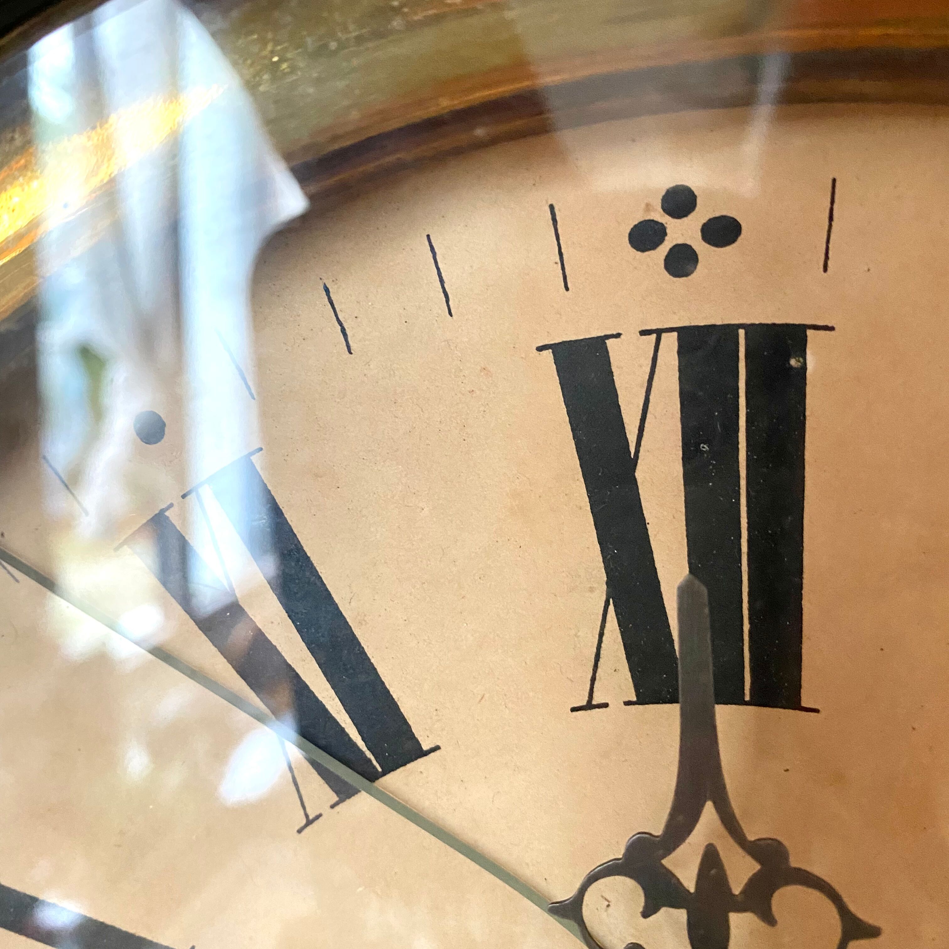 Horloge ancienne œil de bœuf bois et nacre