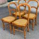 Set of 4 Louis-Philippe medallion chairs in wood with caned seats, 1970s.