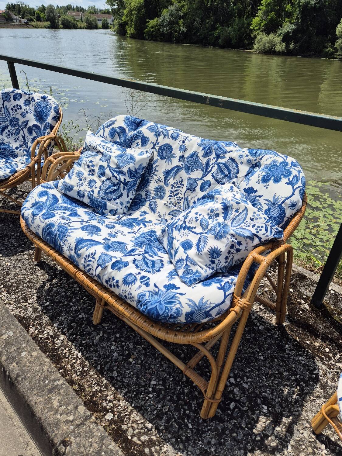 Rattan lounge with two armchairs and a vintage 1950s bench.