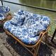 Rattan lounge with two armchairs and a vintage 1950s bench.