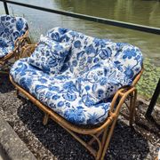 Rattan lounge with two armchairs and a vintage 1950s bench.