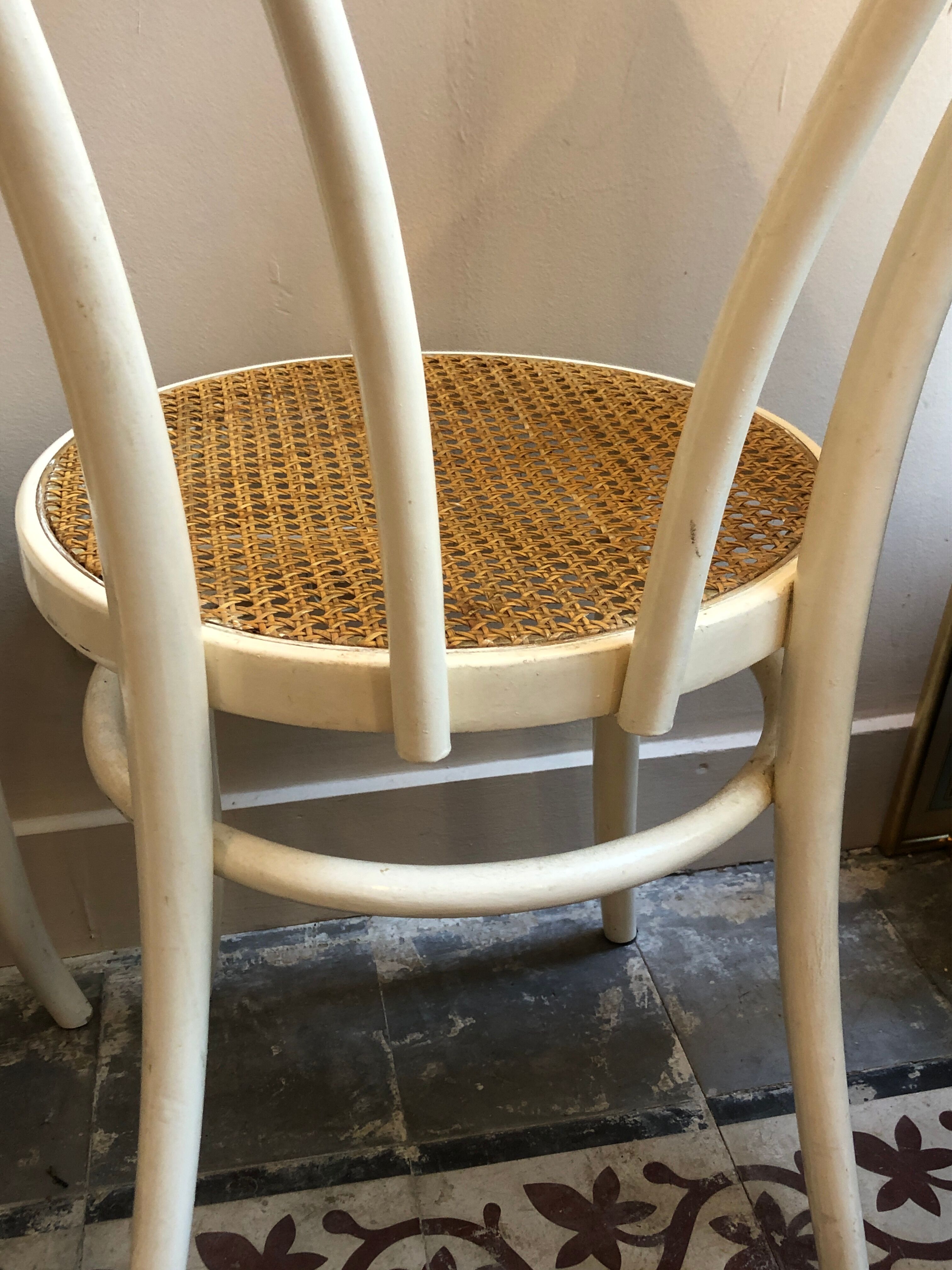 Couple of white bistro chairs