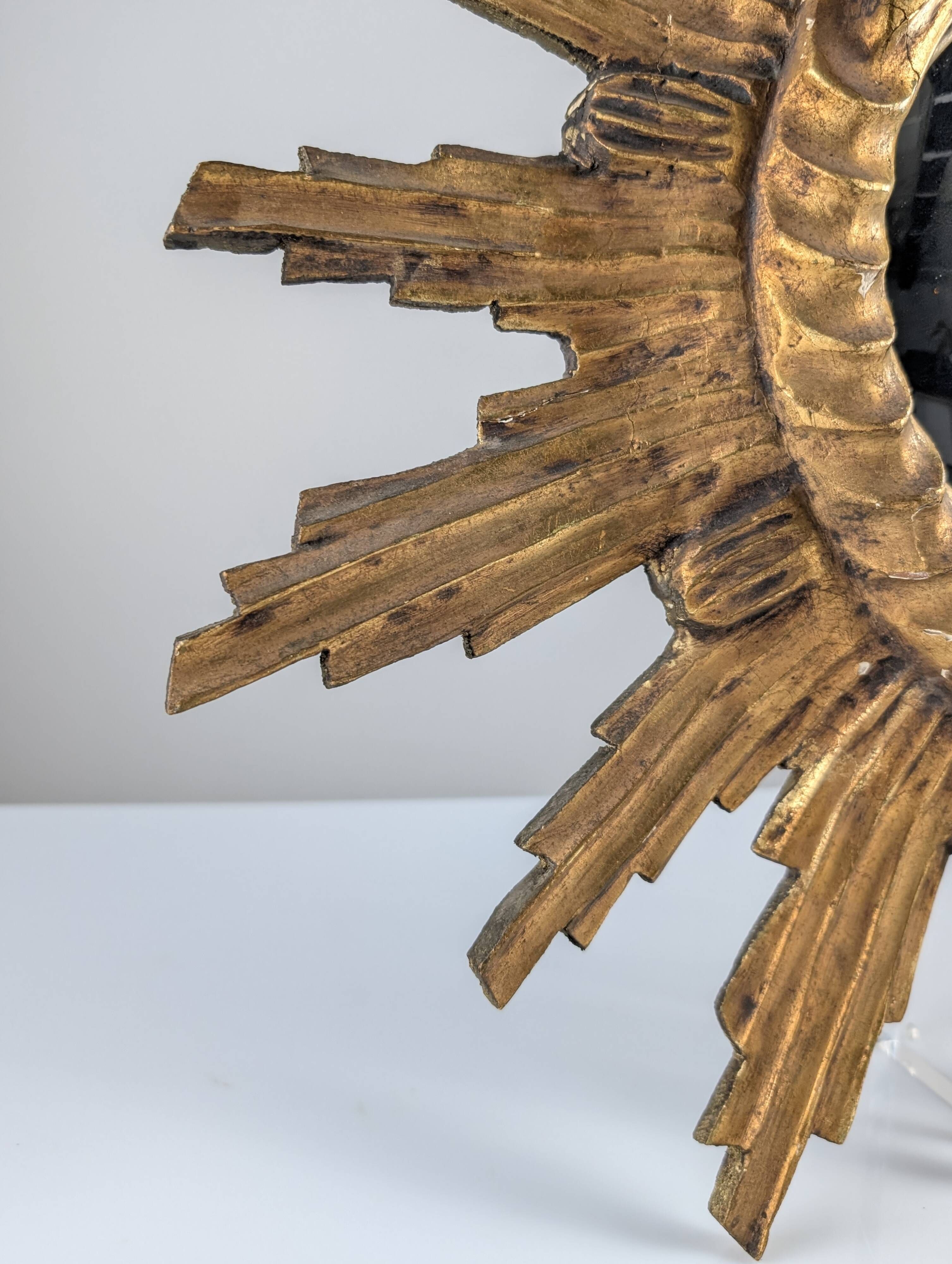Convex sunburst mirror in carved and gilded wood, 1950s