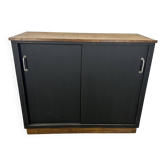 Small vintage black buffet with sliding doors.