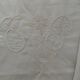 White cotton pillowcase with embroidery and monogram.