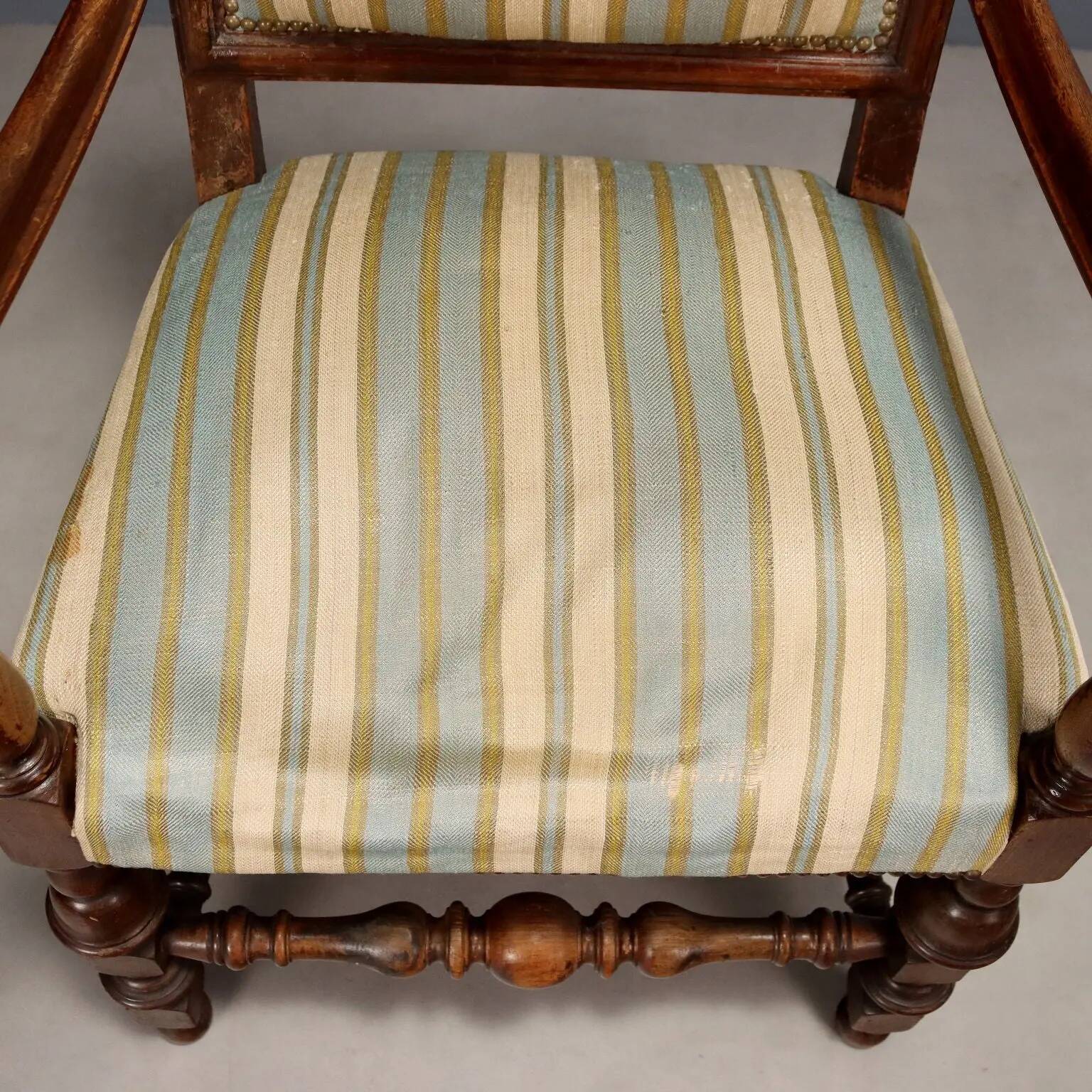 Antique Baroque-style walnut armchair, upholstered, 19th century.