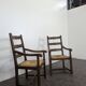 Paire de fauteuils rustiques en chêne assises paillées