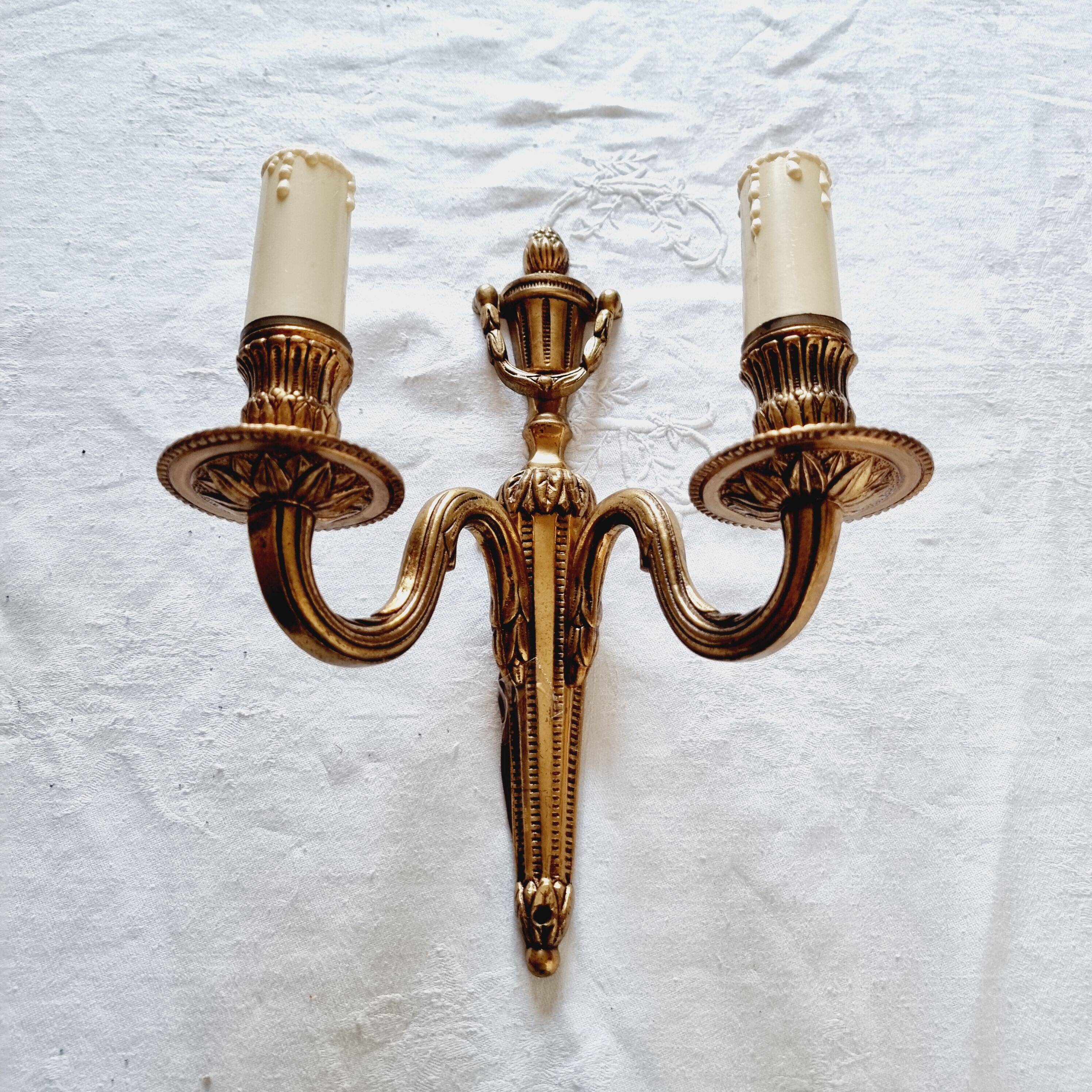 French Empire-style wall sconce or chandelier in bronze with an antique gold patina.