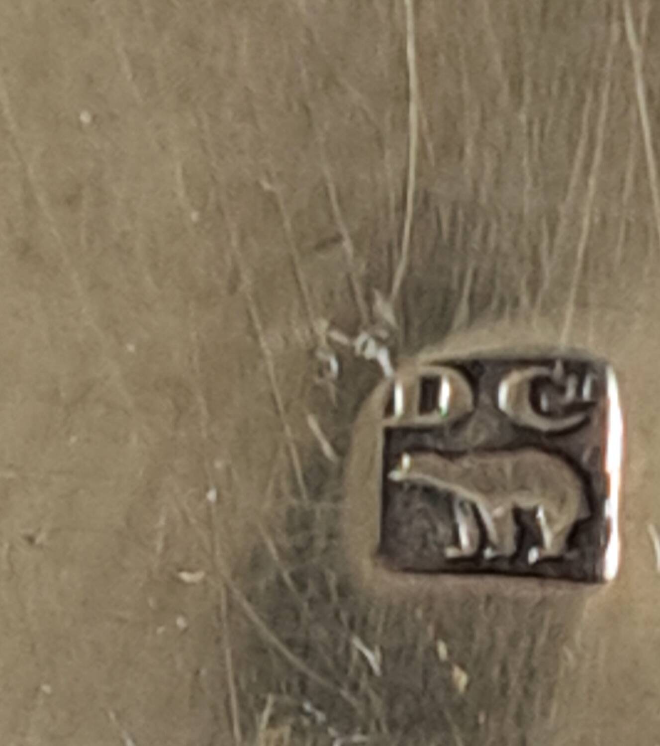 Silver metal cake peeler.