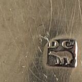 Silver metal cake peeler.