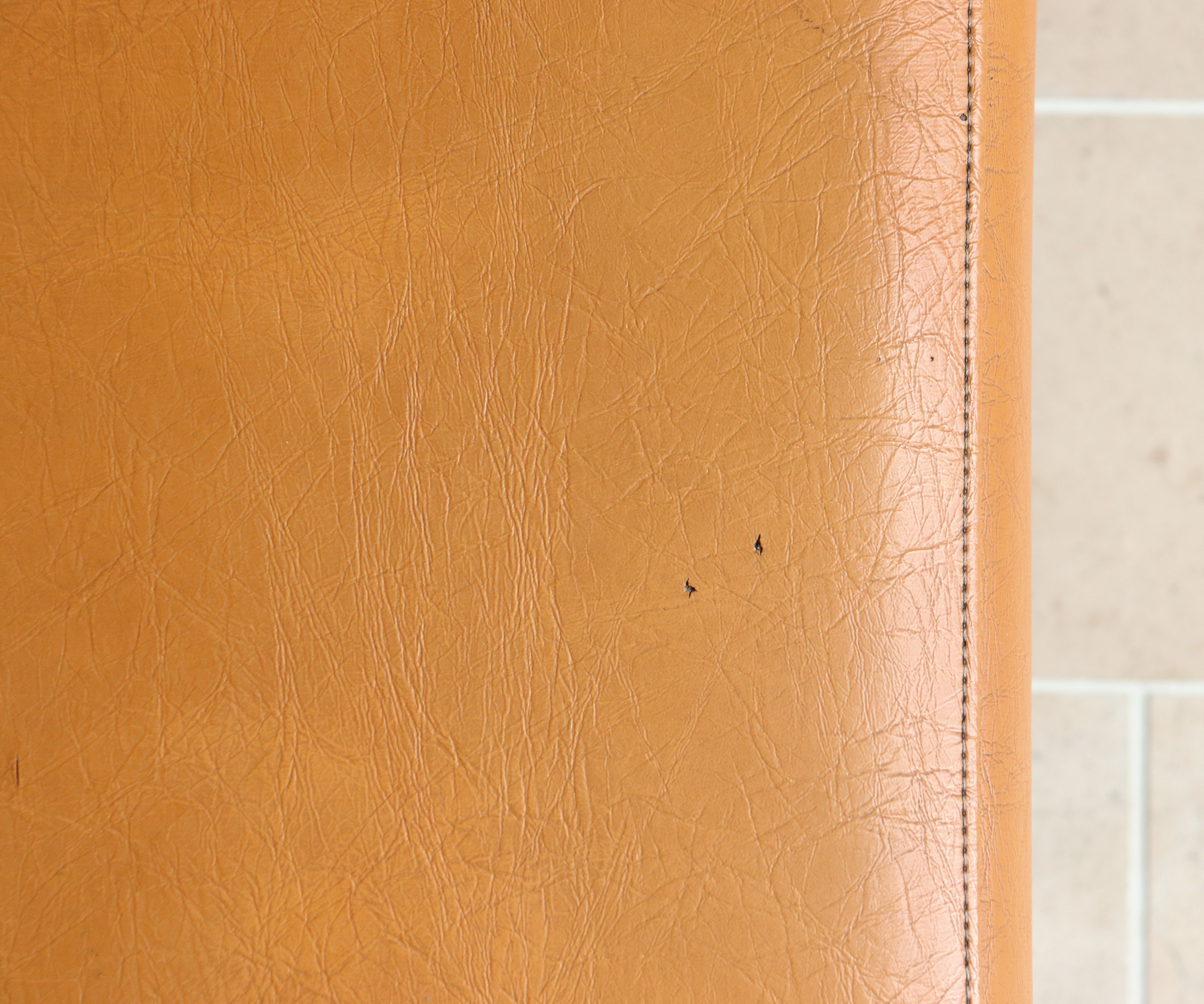 Modernist armchair in chromed metal and imitation leather, 50s/60s