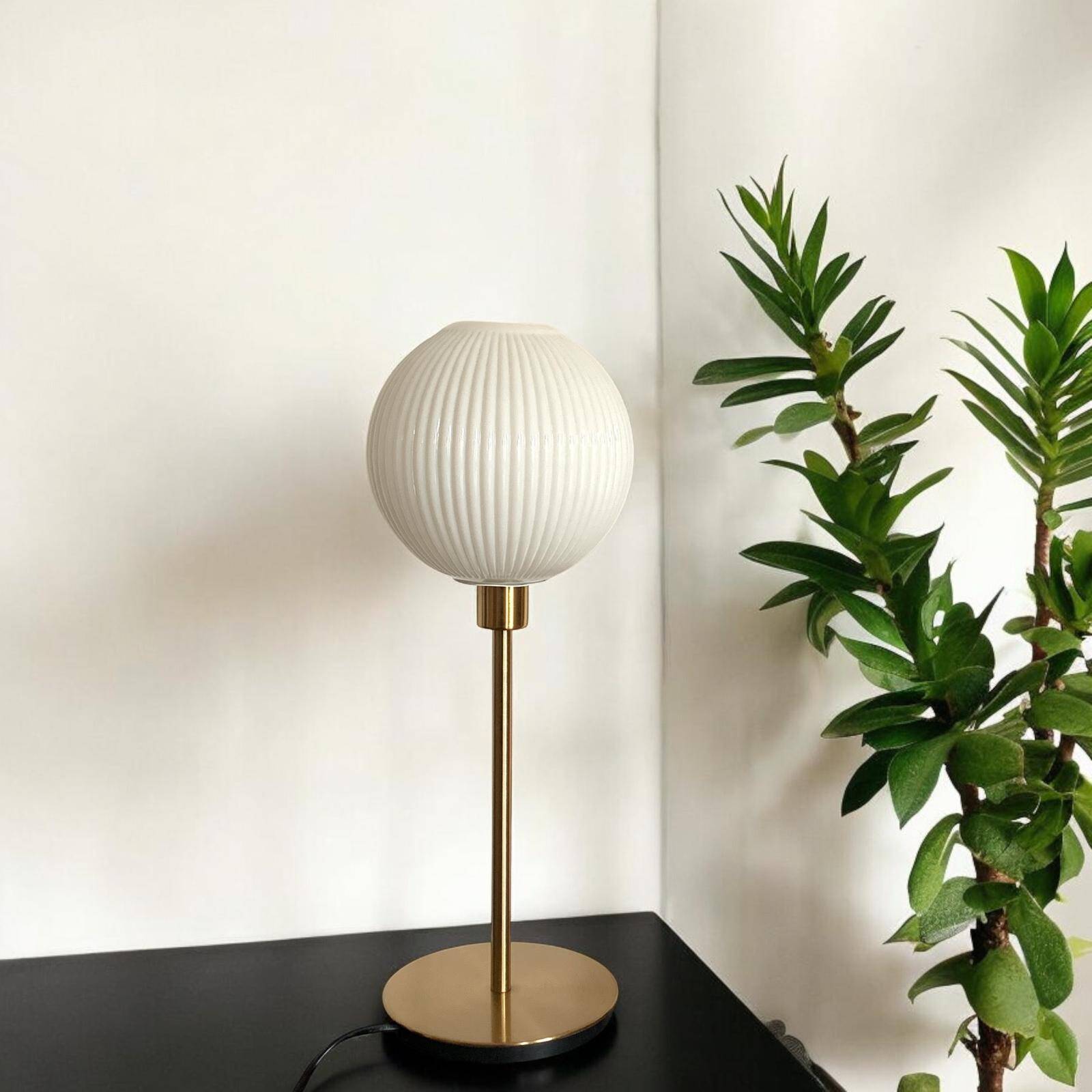 Table lamp with a lampshade from an old vintage pendant light in ribbed white glass and a pi