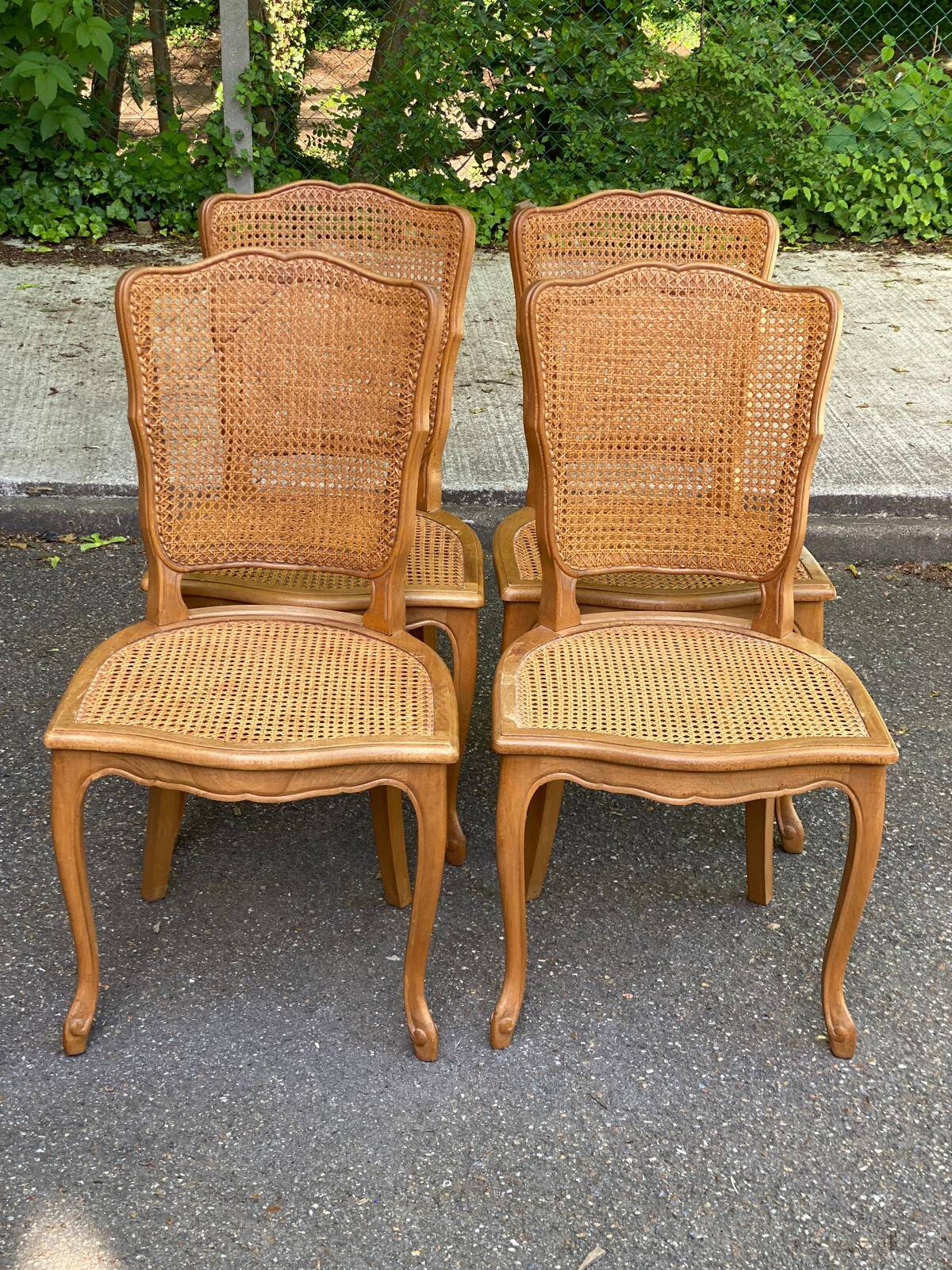 4 Louis XV dining chairs in light solid oak with caning.