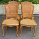 4 Louis XV dining chairs in light solid oak with caning.