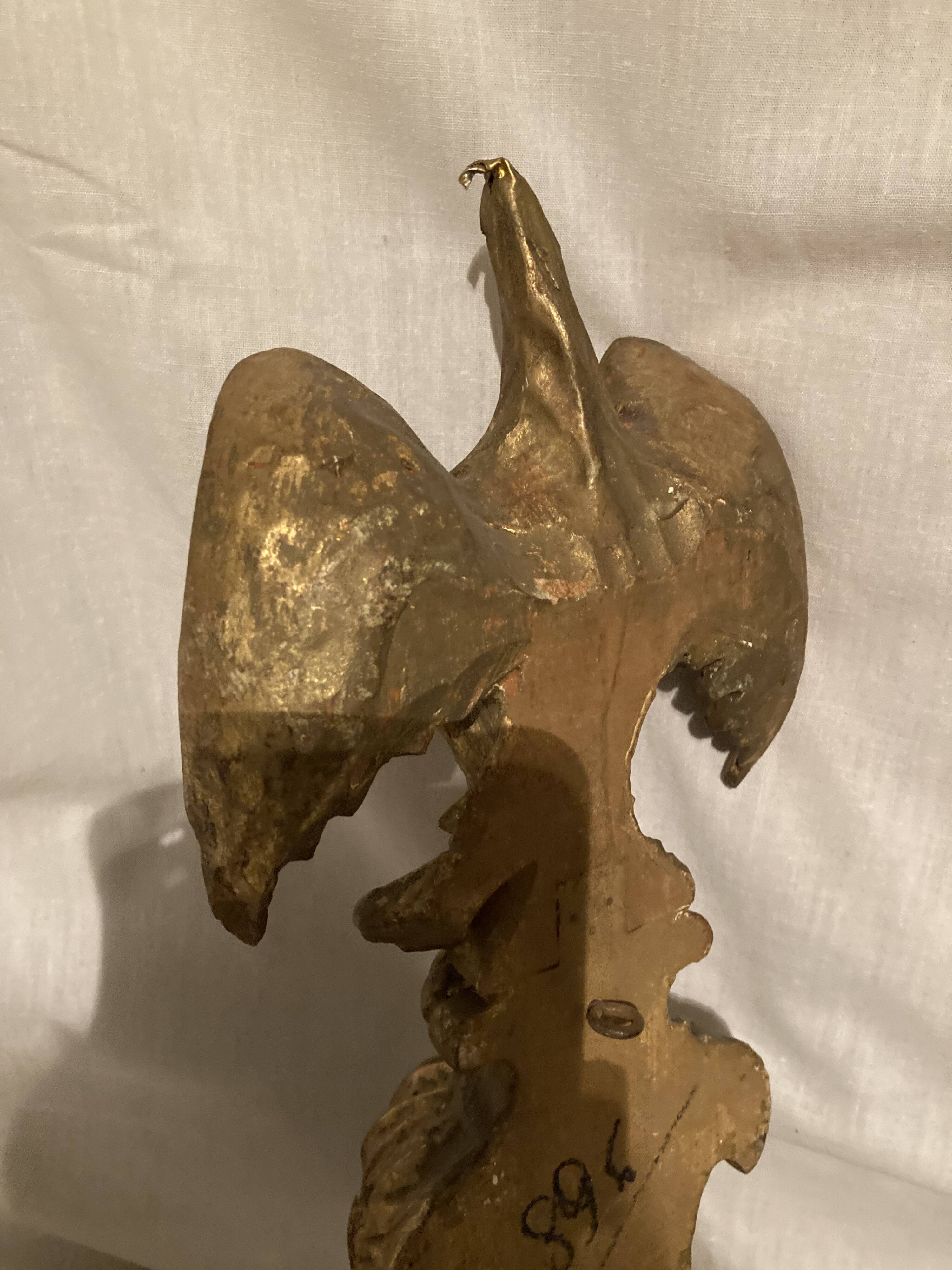 Pair of candle holders in wall, eagle pattern in gilded wood and brass