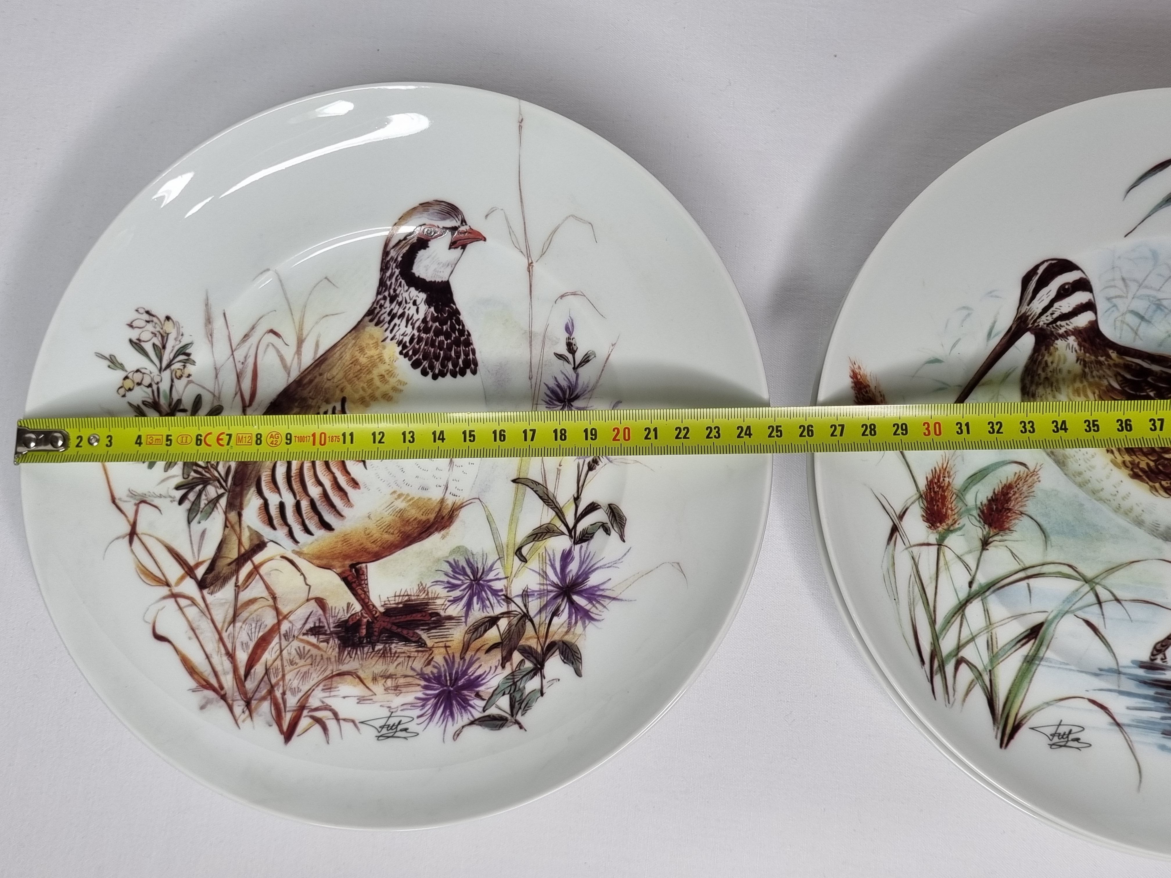 Set of six porcelain plates decorated with birds from Sologne, Limoges, signed, 25 cm