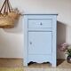 Handcrafted blue chest of drawers.