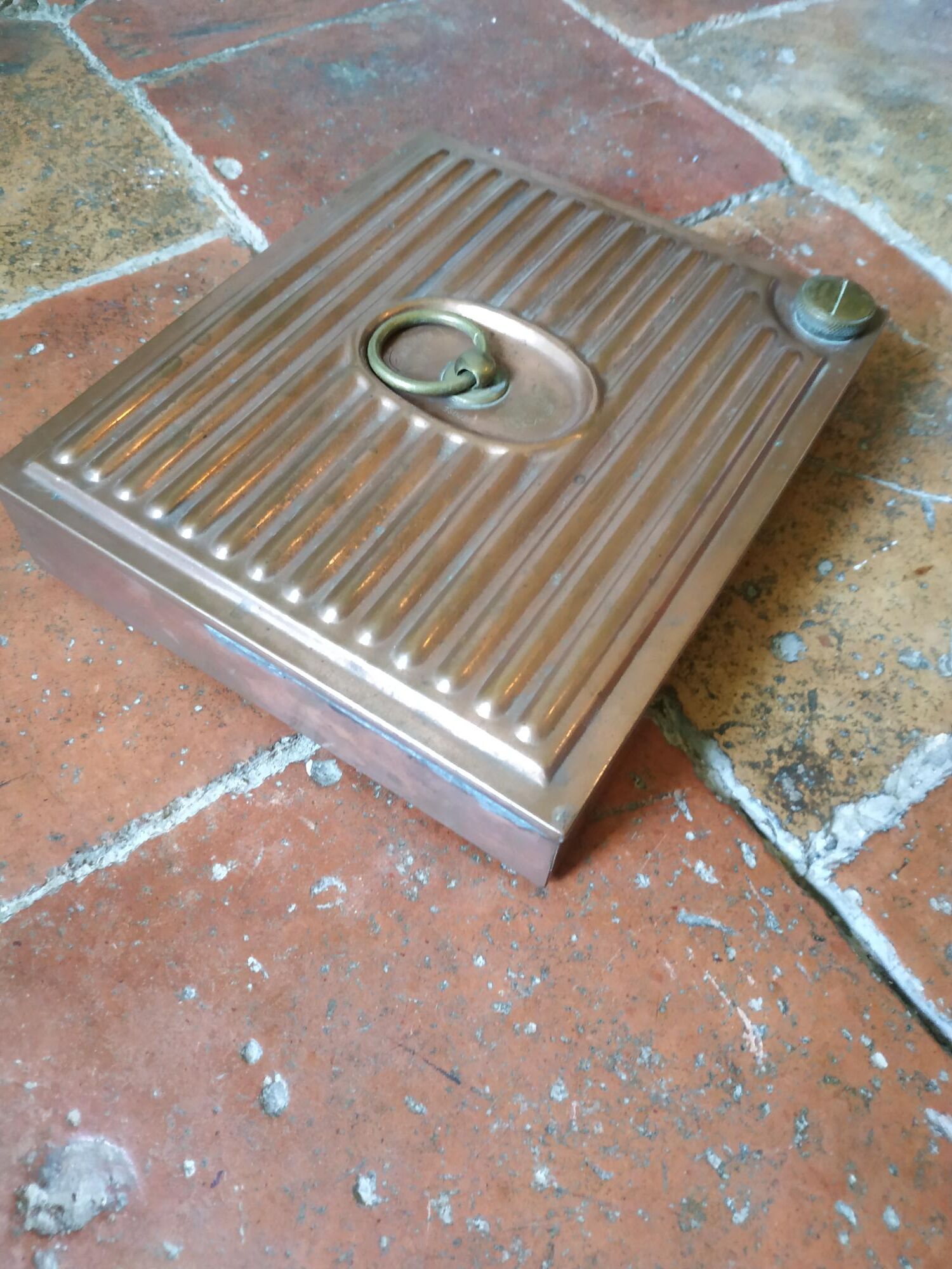 Old copper hot water bottle