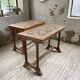 Set of two bistro tables in walnut and tiling from 1890.