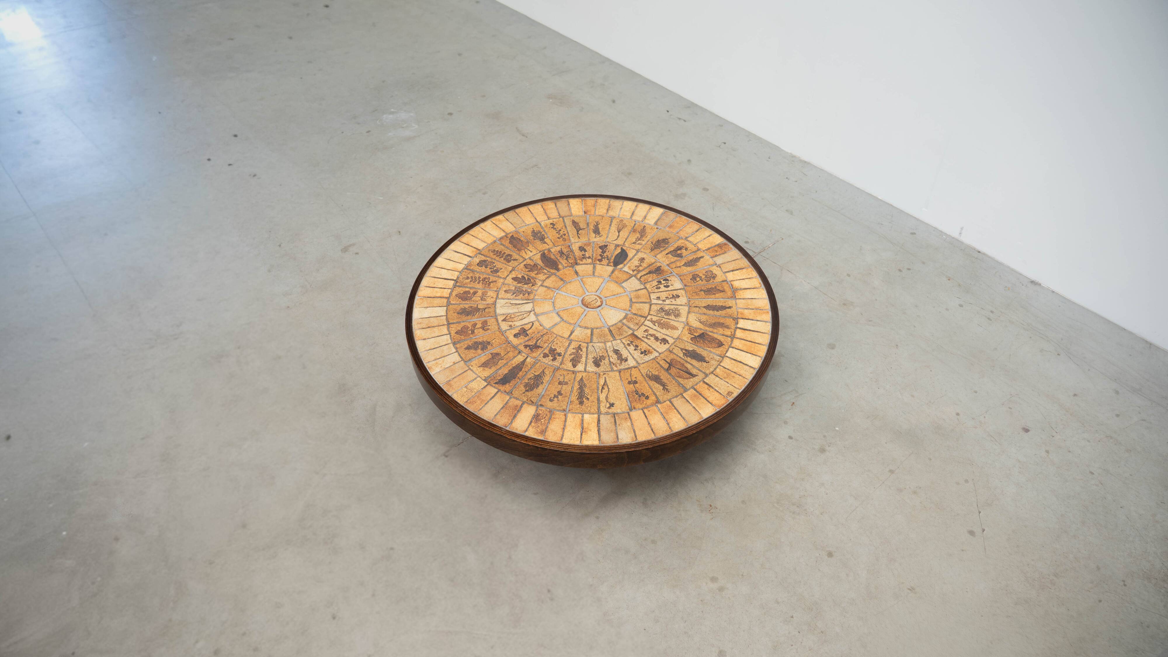 Round coffee table by Roger Capron