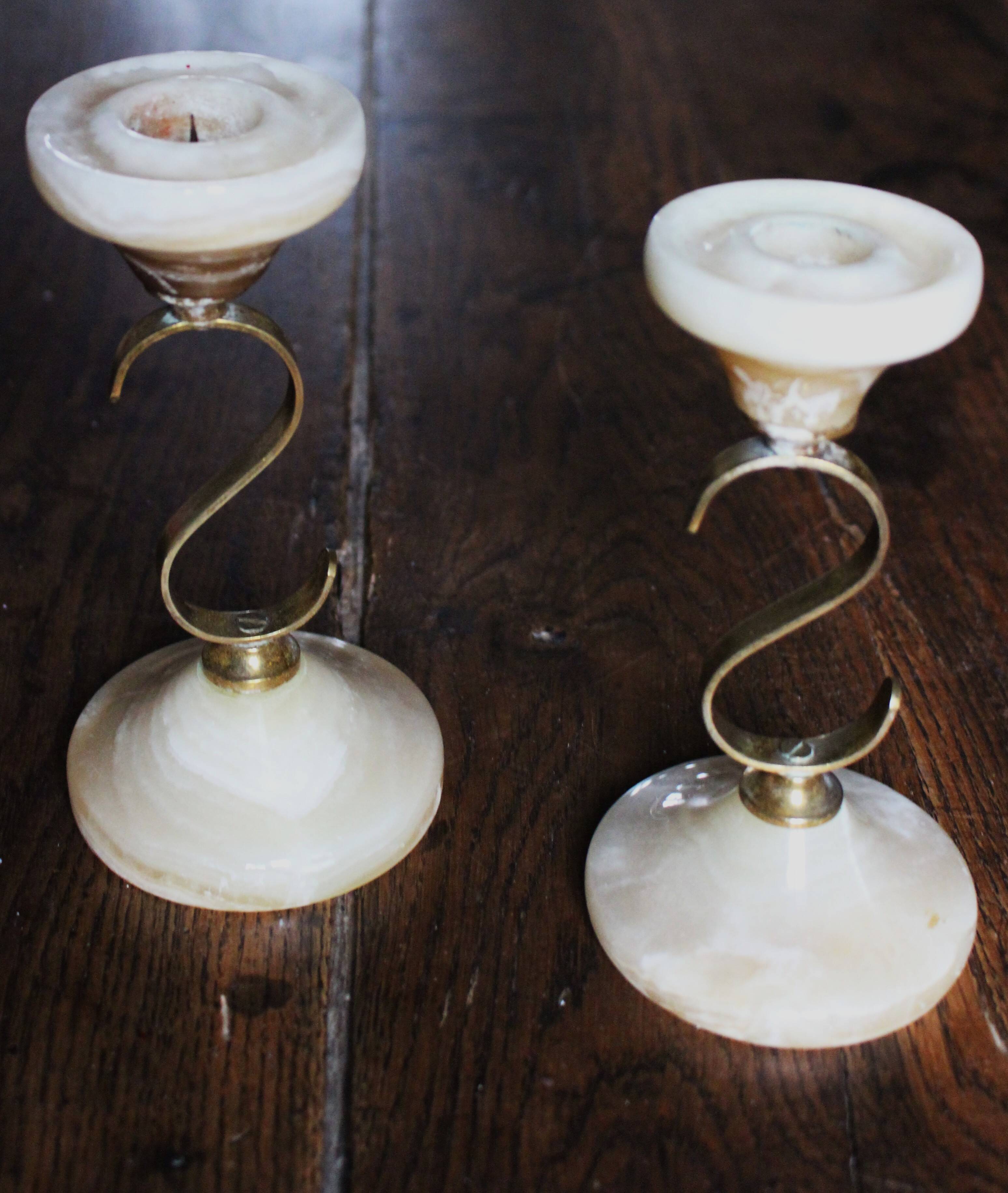 Pair of curved brass candlesticks with onyx