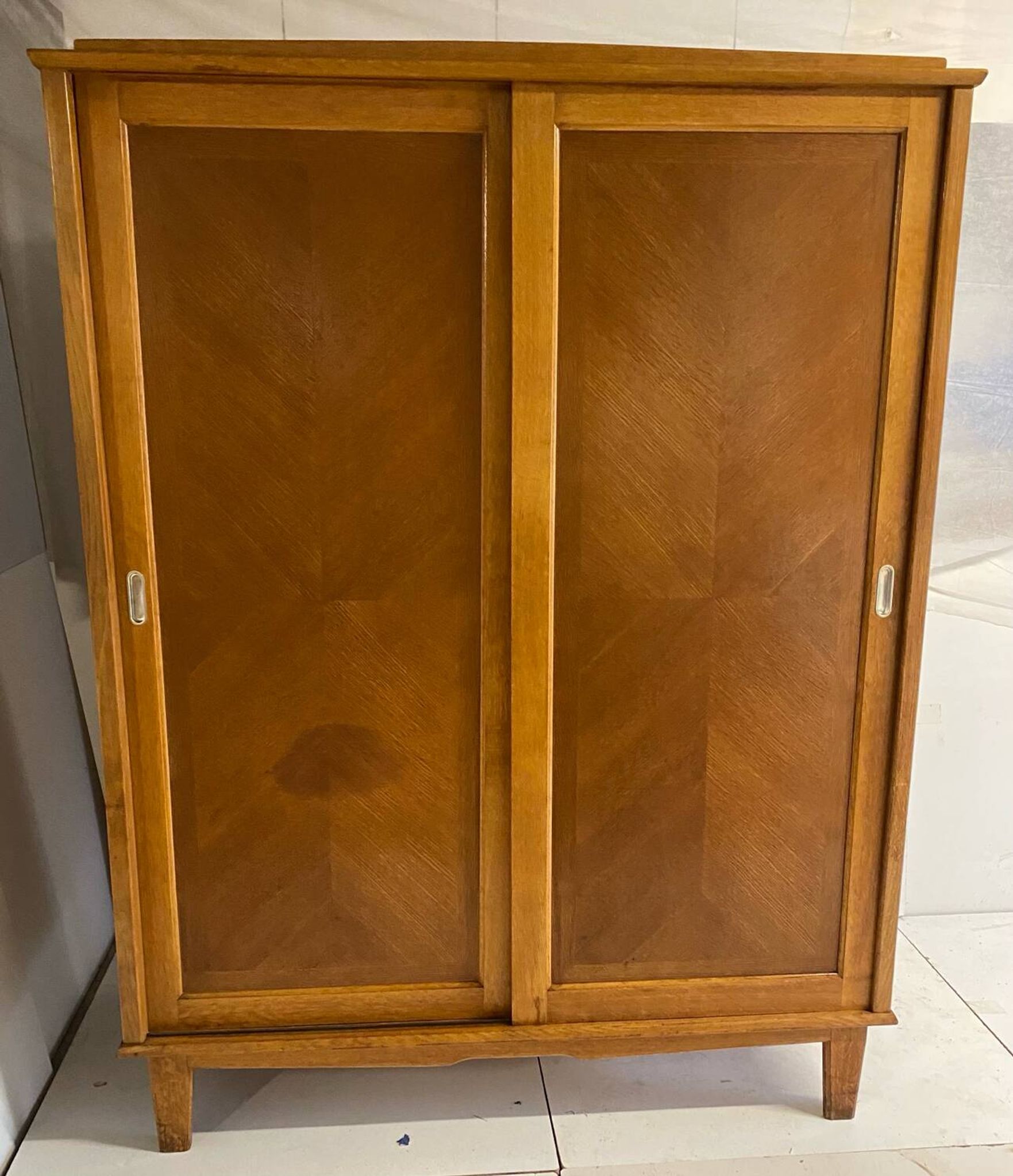 Vintage wardrobe with compass feet, sliding doors