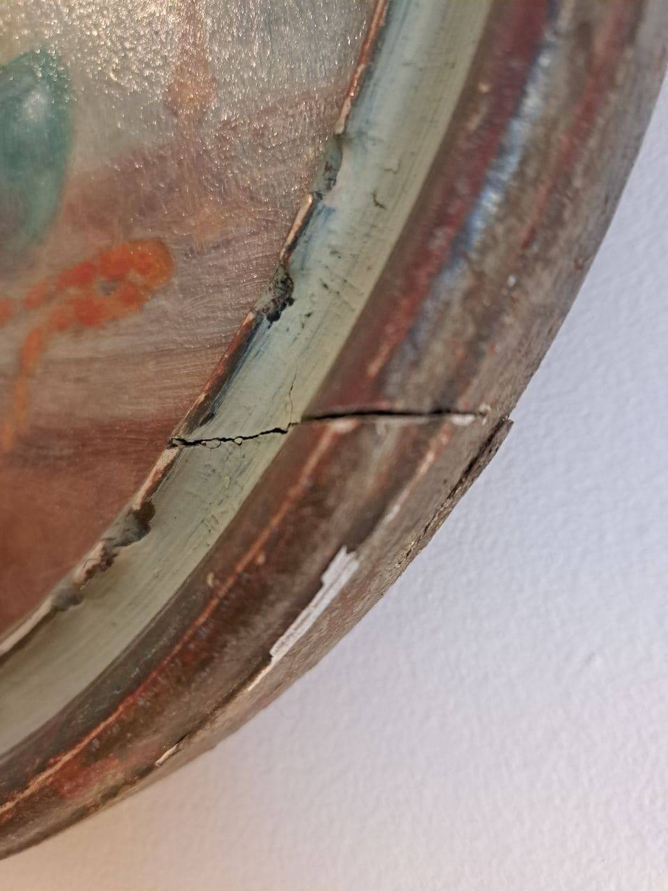 Ancient oval painting of a sleeping woman in oil on wood panel.