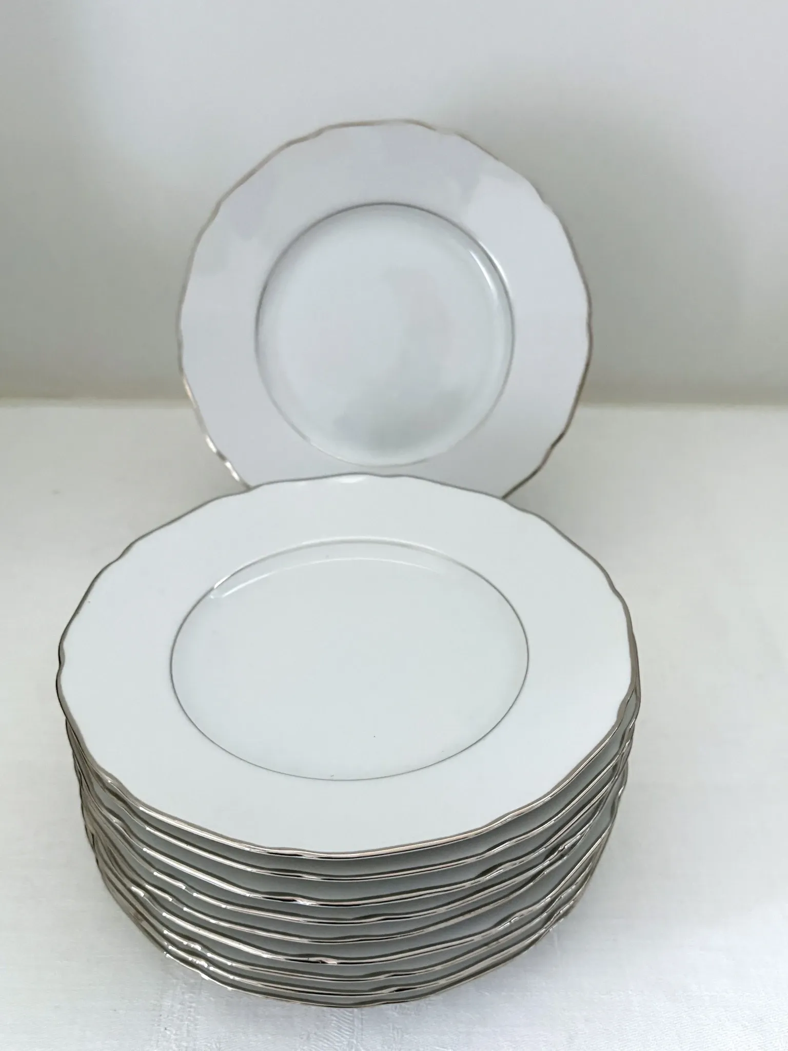 10 white porcelain dessert plates