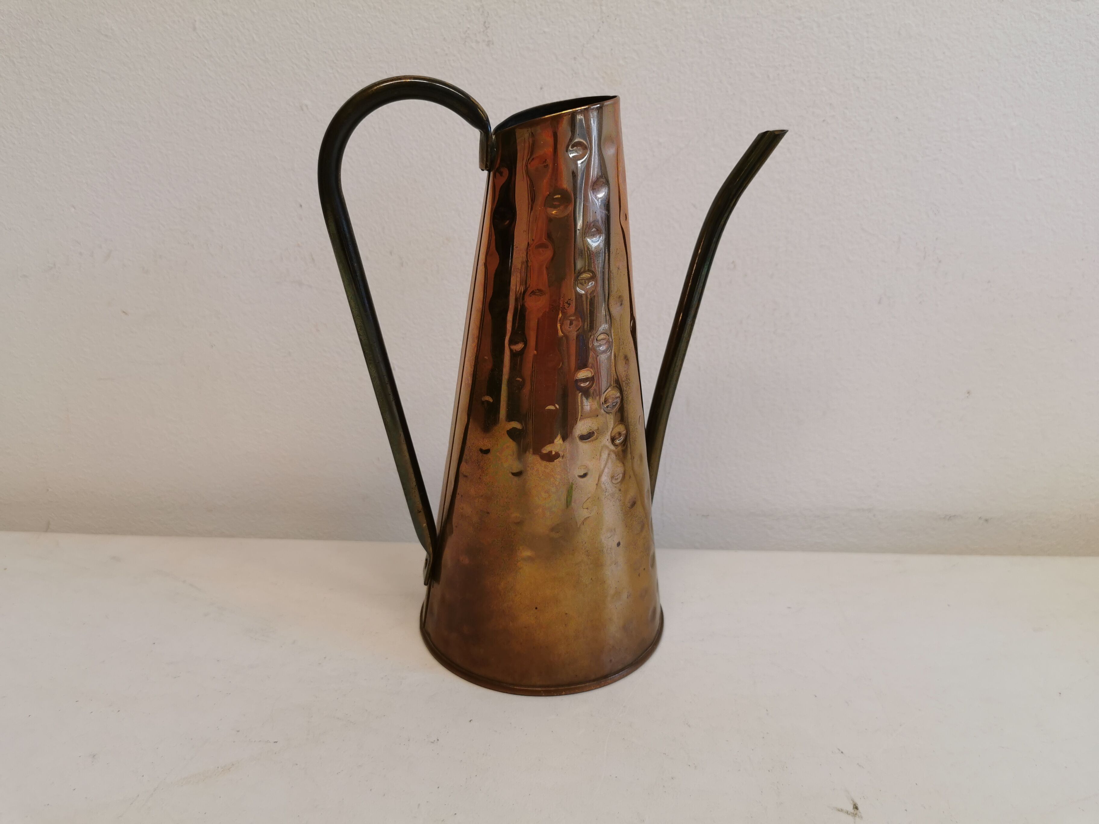 Watering can from the 1950s, made of hammered copper and brass