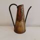 Watering can from the 1950s, made of hammered copper and brass