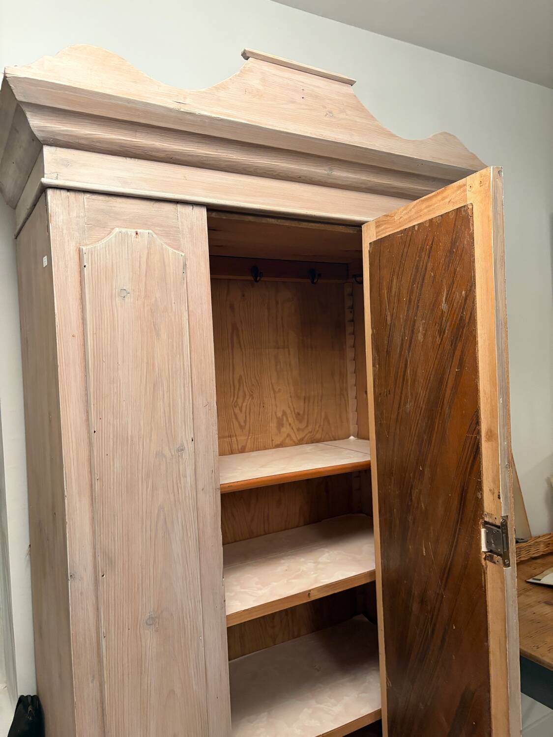 Antique English wardrobe in pale pink patina.