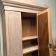 Antique English wardrobe in pale pink patina.