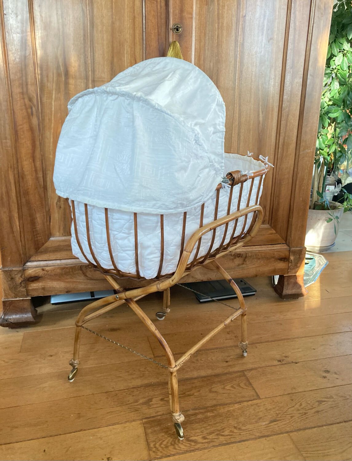 Bamboo, rattan, wicker cradle bassinet from the 1960s with a foldable support.
