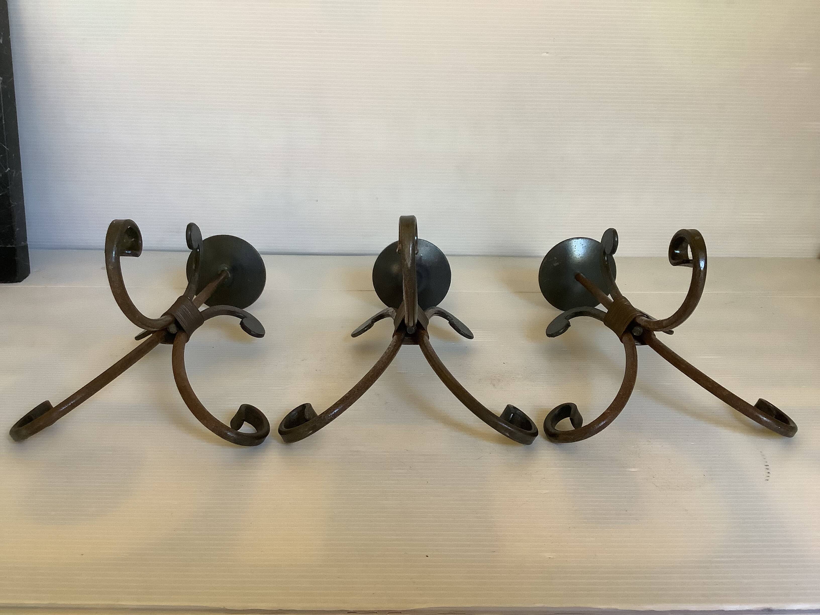 Trio of wrought iron candlesticks