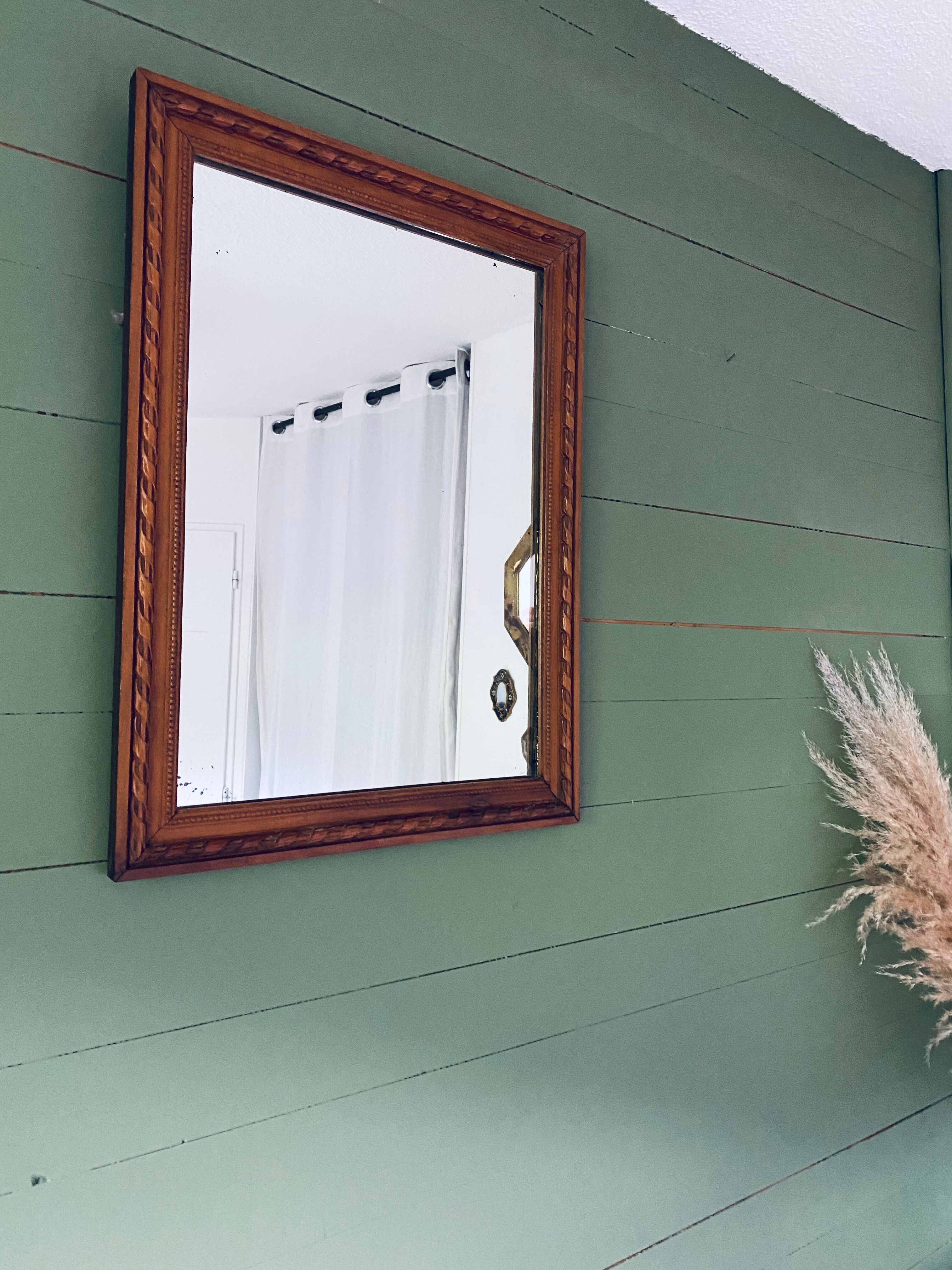 Antique mirror in carved wood and mercury 48x63cm