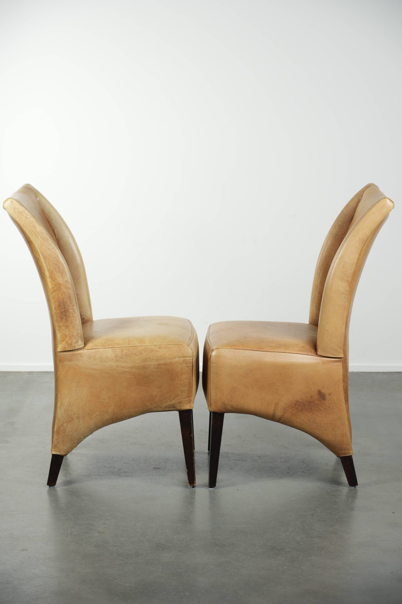 Set of six cowhide dining chairs with a comfortable seat and high back