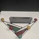 Wall-mounted coat rack attributed to Mathieu Matégot – France, 1950s