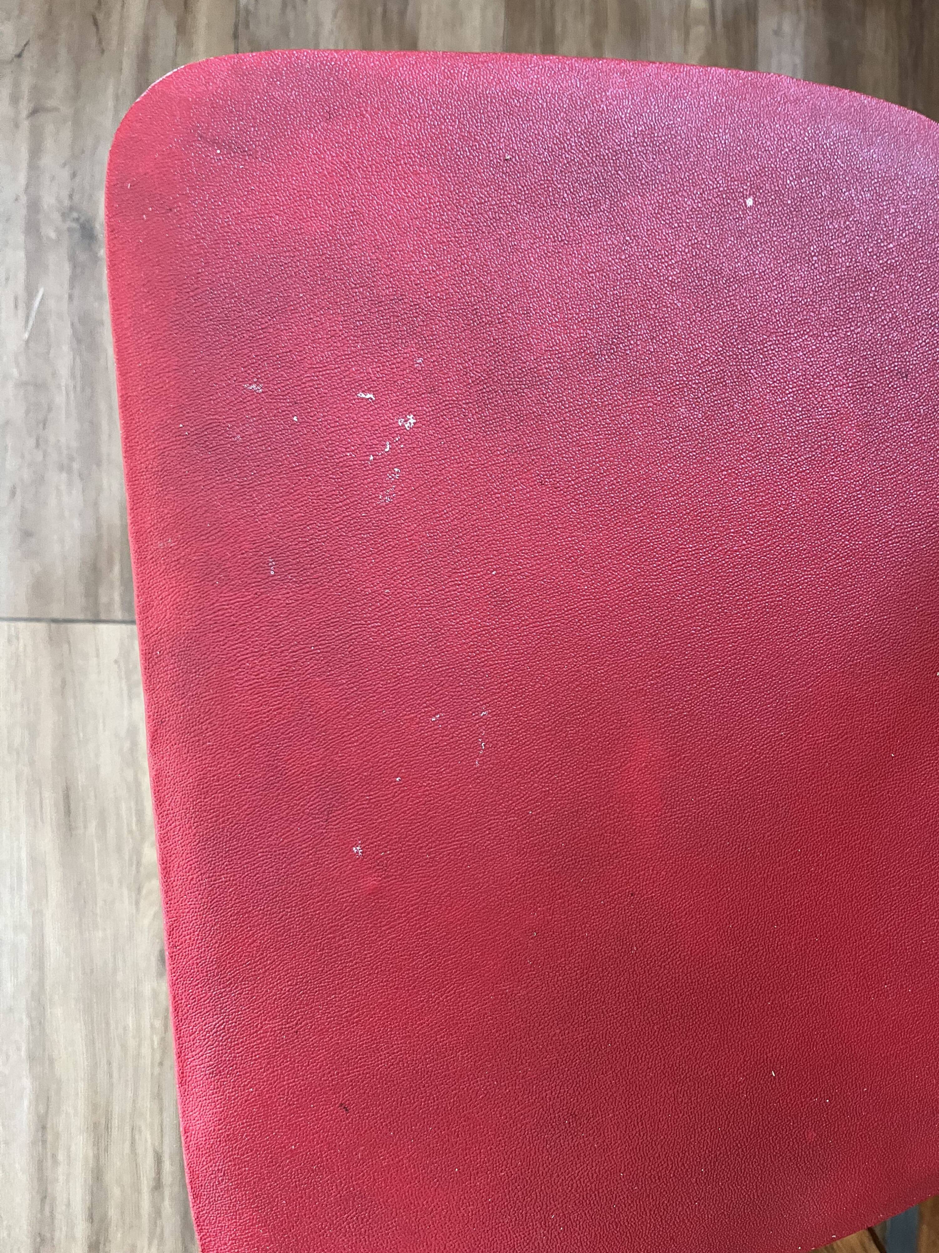 Set of 4 wooden chairs with red vinyl.